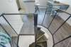 SPIRAL STAIRCASE LEADING TO SECOND LEVEL LIVING AREAS