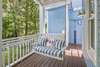 ADJACENT BENCH SWING ON PORCH