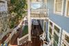 UPPER VIEW OF GENEROUS, PRIVATE YARD, PORCH AND BALCONIES UPPER VIEW OF GENEROUS, PRIVATE YARD, PORCH AND BALCONIES
