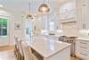LARGE 10 FT QUARTZITE CENTER ISLAND W/BAR SEATING FOR 4 LARGE 10 FT QUARTZITE CENTER ISLAND W/BAR SEATING FOR 4