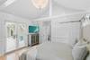 PRIMARY KING BEDROOM WITH FRENCH DOORS TO THE COURTYARD PRIMARY KING BEDROOM WITH FRENCH DOORS TO THE COURTYARD