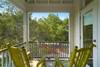 TWO ROCKING CHAIRS ON PORCH OVERLOOKING FOREST STREET TWO ROCKING CHAIRS ON PORCH OVERLOOKING FOREST STREET
