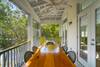 SUITE I SECOND FLOOR BALCONY WITH DINING TABLE AND ROCKING CHAIR SUITE I SECOND FLOOR BALCONY WITH DINING TABLE AND ROCKING CHAIR