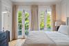 PRIMARY KING BEDROOM WITH FRENCH DOORS AND PRIVATE BALCONY PRIMARY KING BEDROOM WITH FRENCH DOORS AND PRIVATE BALCONY
