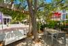 OUTDOOR DINING FOR 4 AND SWING IN BACKYARD BEHIND PICKET FENCE OUTDOOR DINING FOR 4 AND SWING IN BACKYARD BEHIND PICKET FENCE