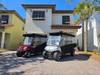 Two Golf Carts with Weather Enclosures