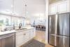 Kitchen Overlooking Living and Dining Areas