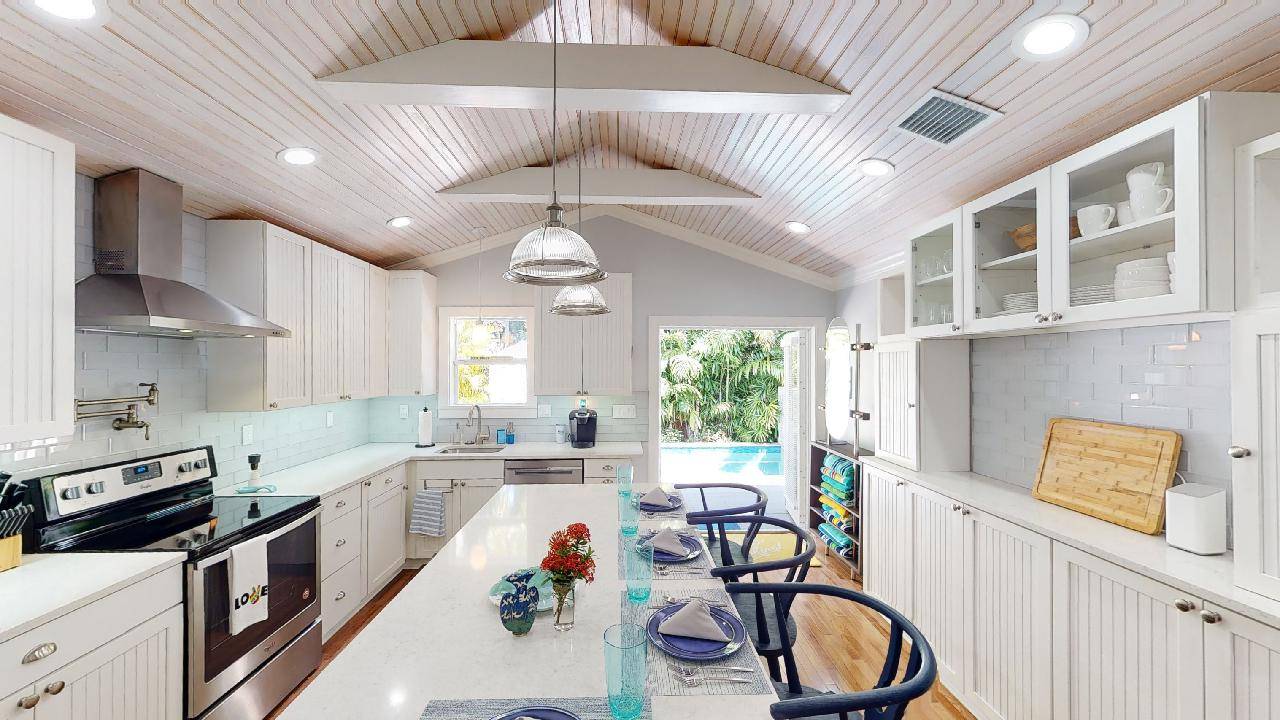 Large Kitchen/French Doors leading to pool.