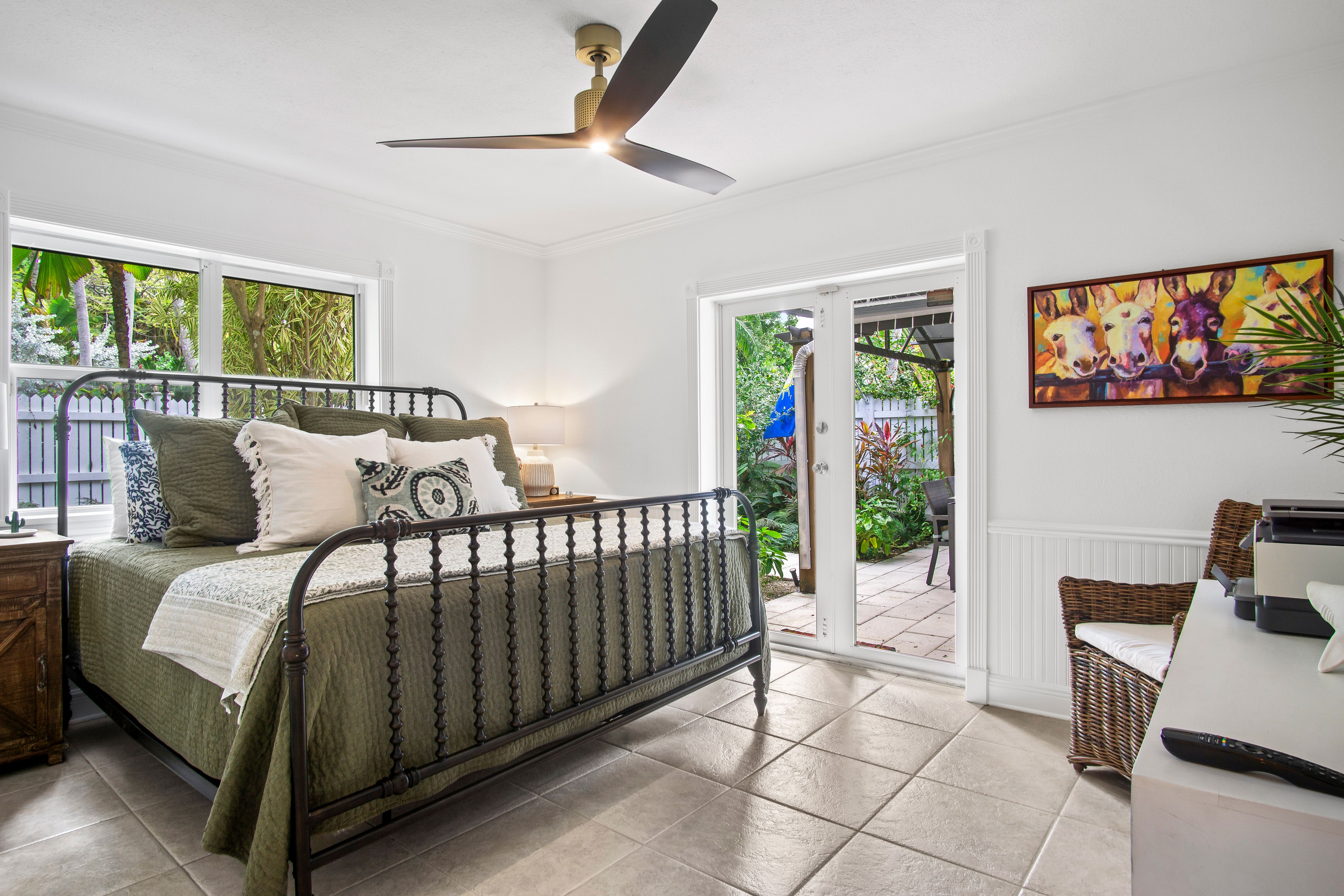 Guest room with doors that lead to the deck