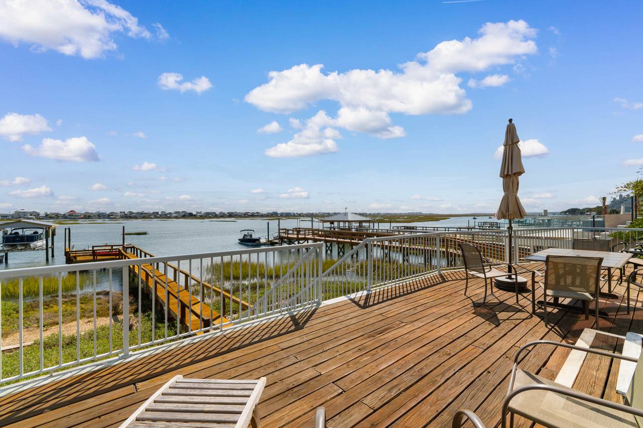 Inlet front porch off the first floor with direct dock access Inlet front porch off the first floor with direct dock access