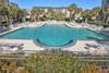 Spacious pool with plenty of pool deck seating.