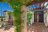 49 TRELISSED ENTRY WALK - Oranj Palm Vacation Homes.jpg