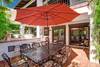 40 OUTDOOR DINING AREA POOLSIDE - Oranj Palm Vacation Homes.jpg