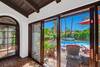 5 LIVING ROOM SLIDERS OUT TO POOL DETAIL - Oranj Palm Vacation Homes.jpg