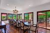 12 DINING ROOM OUT TO POOL AND SPA PATIO - Oranj Palm Vacation Homes.jpg