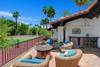 OUTDOOR SEATING AREA WITH BAR AND FIREPIT NEXT TO TENNIS COURT.jpg