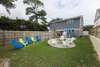 Enclosed back yard with fire pit and plenty of seating