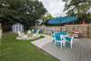Enclosed back yard with fire pit and plenty of seating