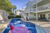 Patio and pool with privacy fence, perfect for entertaining