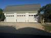 Spacious driveway with three car garage