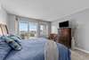 Bedroom with balcony overlooking marina