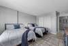 Bedroom with two queen beds with balcony overlooking marina