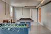 Pool Table and Foosball Table In Garage