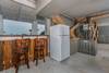 Bar in garage overlooking pool