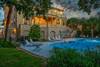 Backyard pool with hot tub