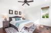 Second floor King Primary Suite with Flat Screen TV and spacious walk-in closet.