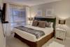 Master bedroom with a king bed