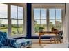 Sun room off of primary bedroom 1 on first floor with ocean views