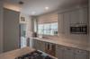 Fully stocked kitchen and laundry area accessible from the back door and outdoor shower area