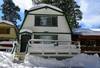 Snow covered Big Bear Cool Cabins, Bear N Tree front