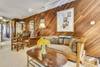 Living, dining and kitchen space with Murphy bed stored