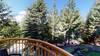 Balcony off the bedroom - forest view with a peak-a-boo-view of the mountains