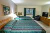 Get a good nights sleep in this bedroom with 2 double beds,43" flat screen TV and A/C.