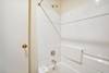 Full sized bathroom with a bathtub/shower combination.