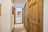 The hallway has plenty of closets.