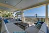 First floor porch overlooking pool and ocean