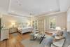 Bedroom 1: Master Suite, King Bed, Sitting Area with Sofa, Private Bath (dual vanities, walk-in shower, separate soaking tub), First Floor