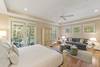 Bedroom 1: Master Suite, King Bed, Sitting Area with Sofa, Private Bath (dual vanities, walk-in shower, separate soaking tub), First Floor