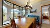 Dining area with large patio doors to covered deck