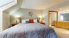 Master bedroom with vanity and en-suite bathroom