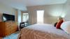 Master bedroom with king bed and 40" smart TV