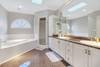 Master bath with shower and soaking tub.
