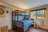 Lower level queen + single bunk bed with ensuite bath