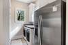 Laundry room with additional fridge