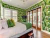 Ensuite bathroom with Tub/Shower combo, access to back porch and pool deck.