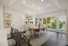 Dining room table seating for 8, plus 3 more at kitchen bar counter.